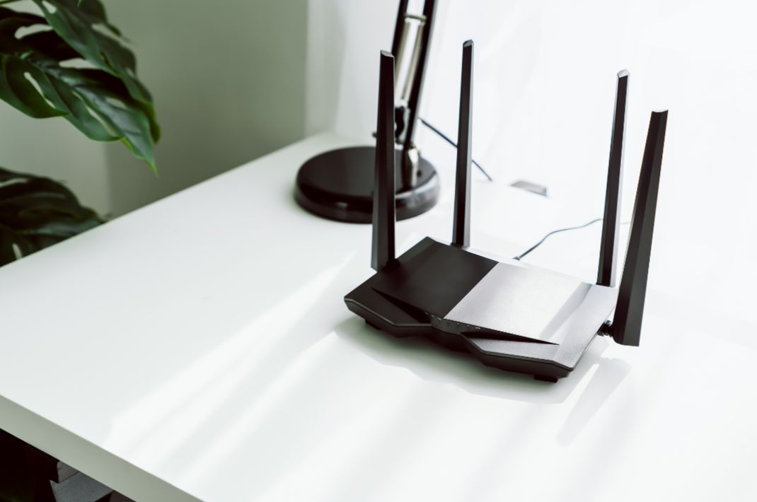 A Wi-Fi router on a home office desk