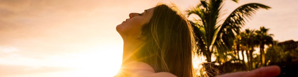 Woman looks at the sunset