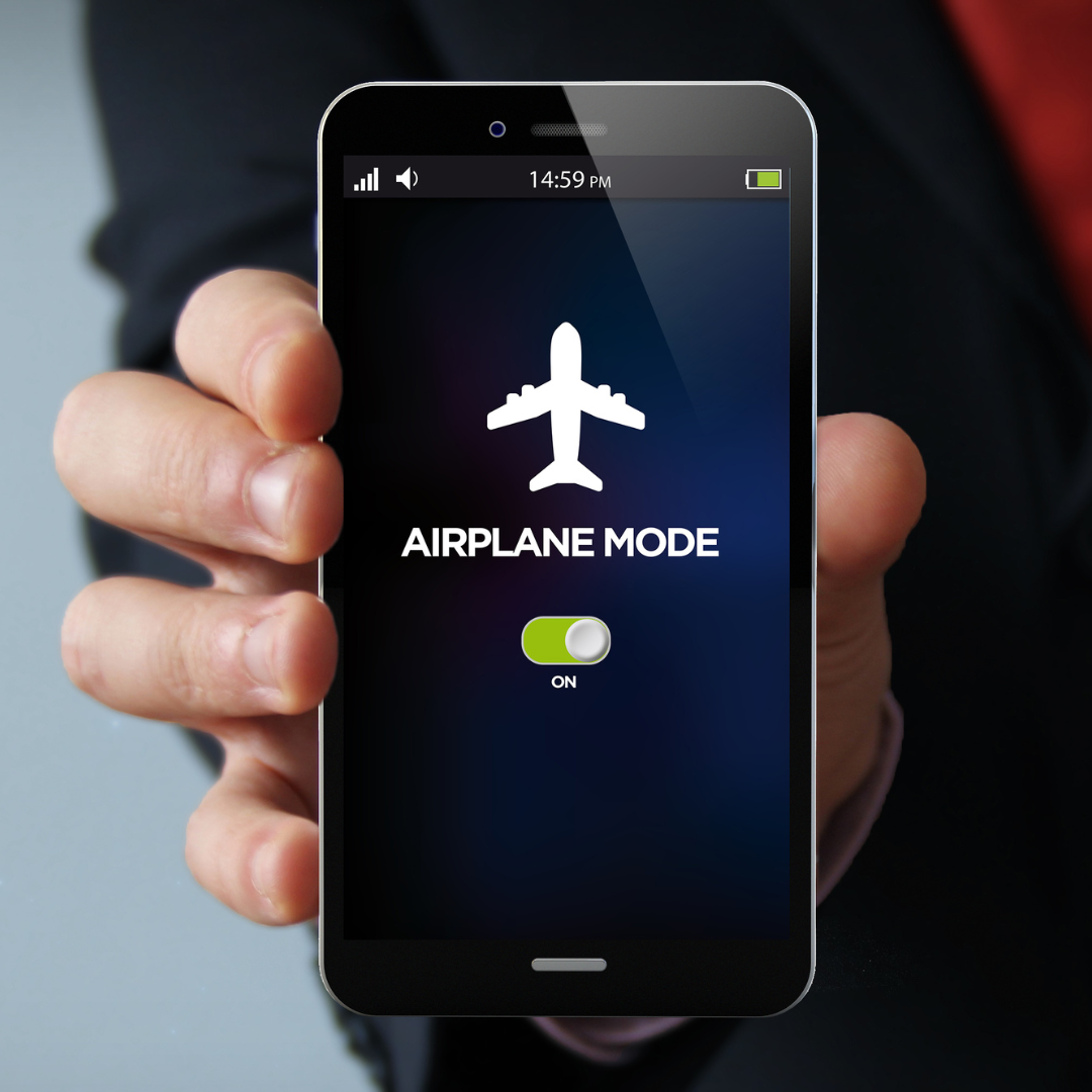 Businessman with Phone in Airplane Mode