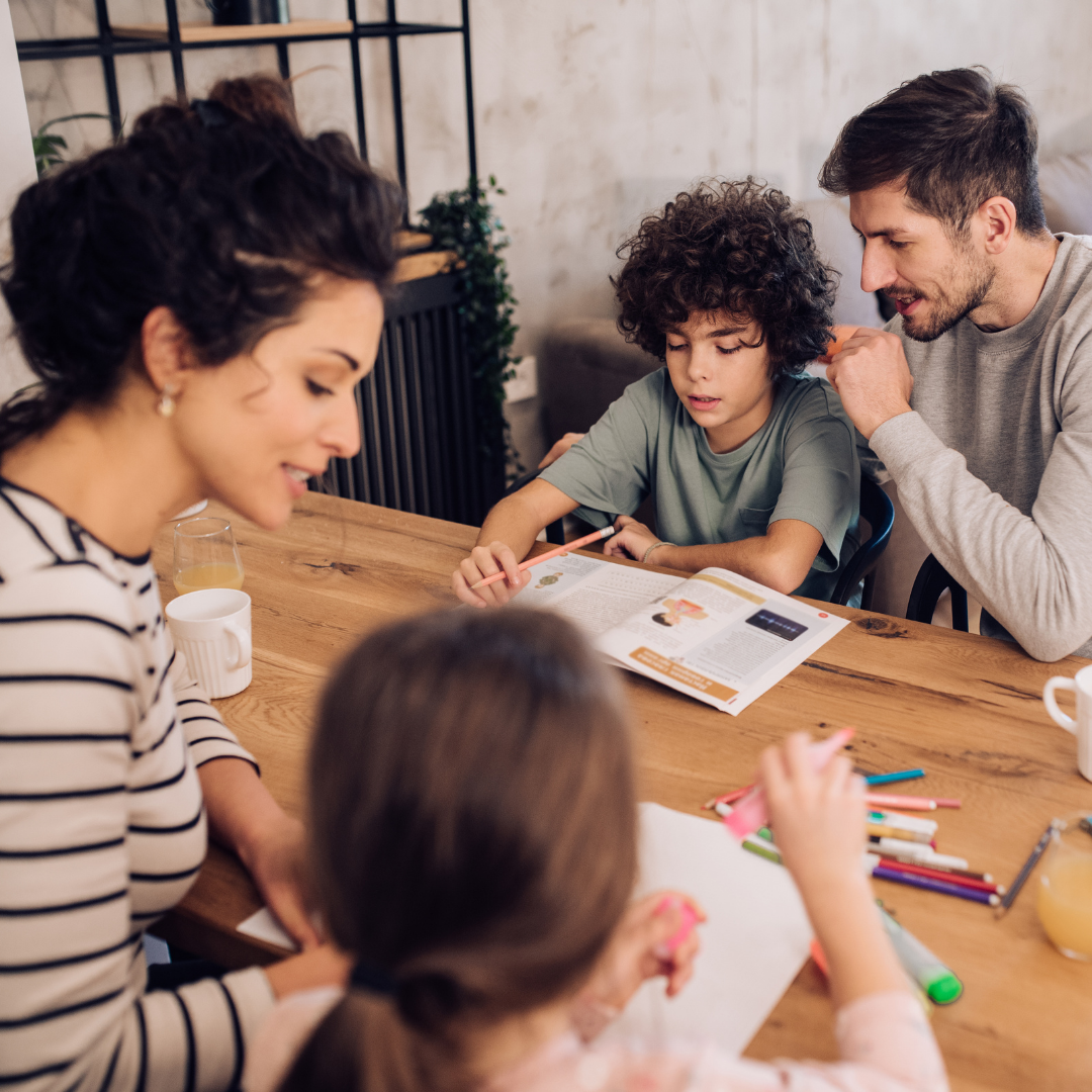 Kids doing homework with their parents