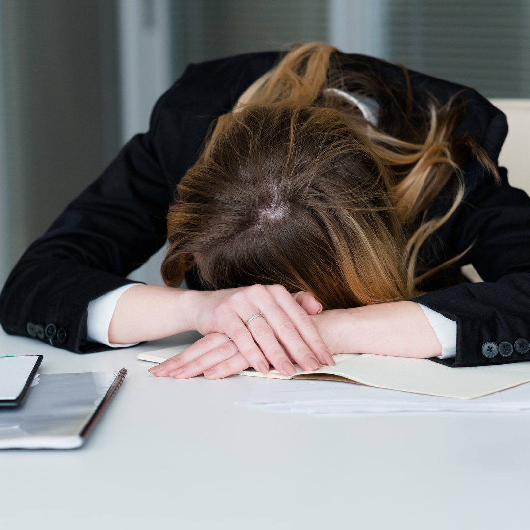 stress deadline overworking exhausted woman desk