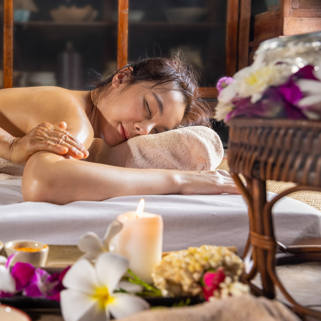 Woman relaxing while get oil massage at thai traditional spa salon