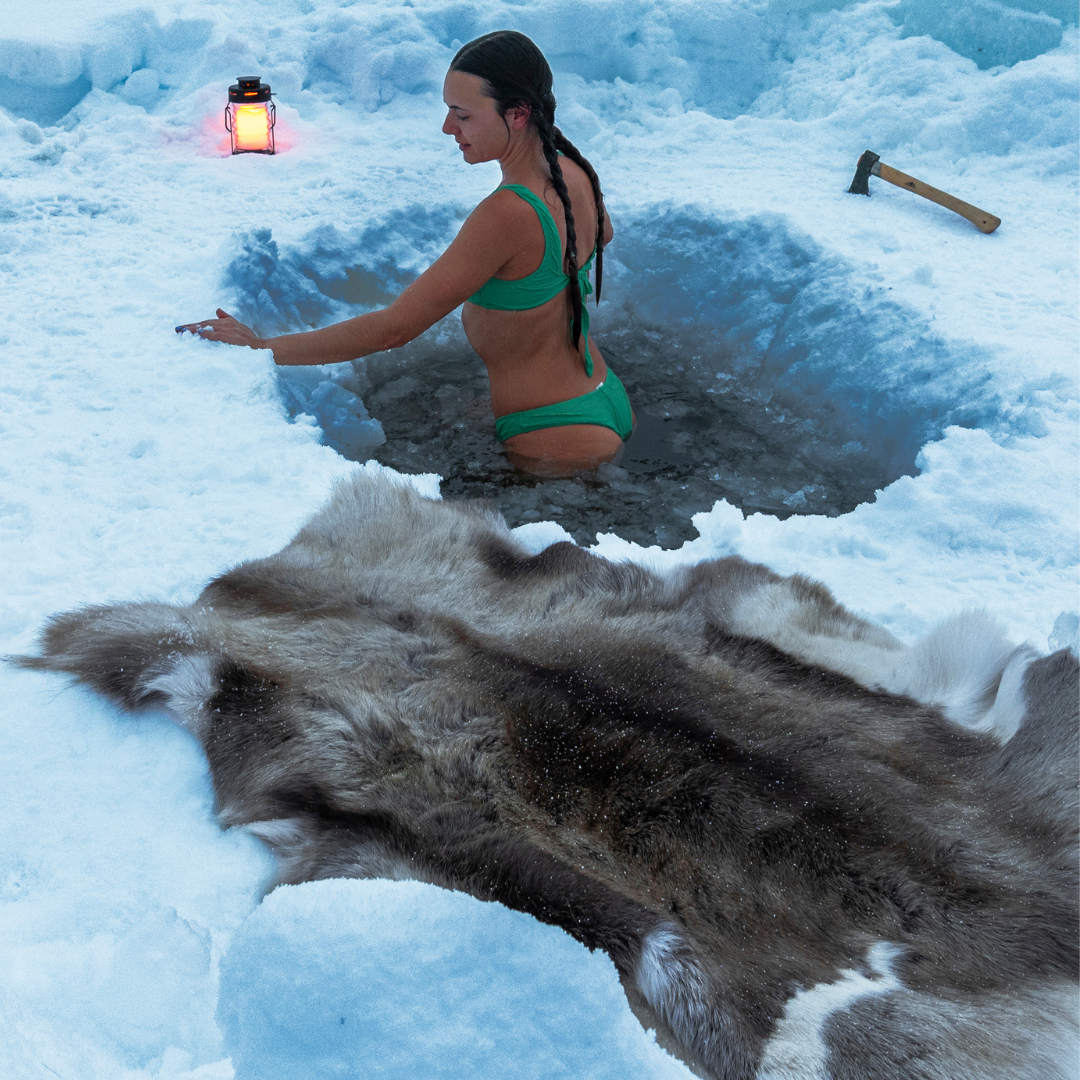 Woman enjoys ice bath, Lapland