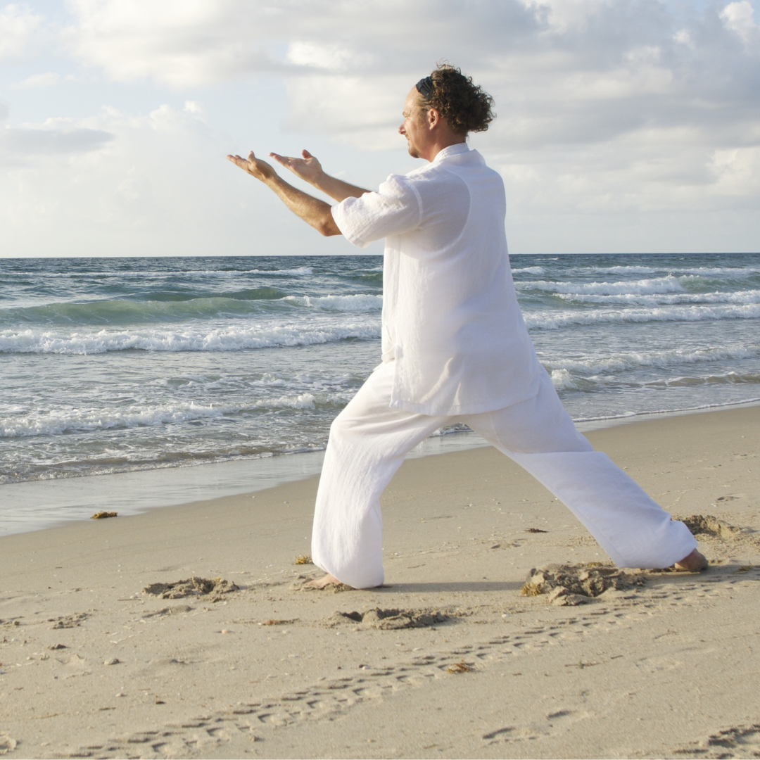 Man Practicing Qigong at the Beach