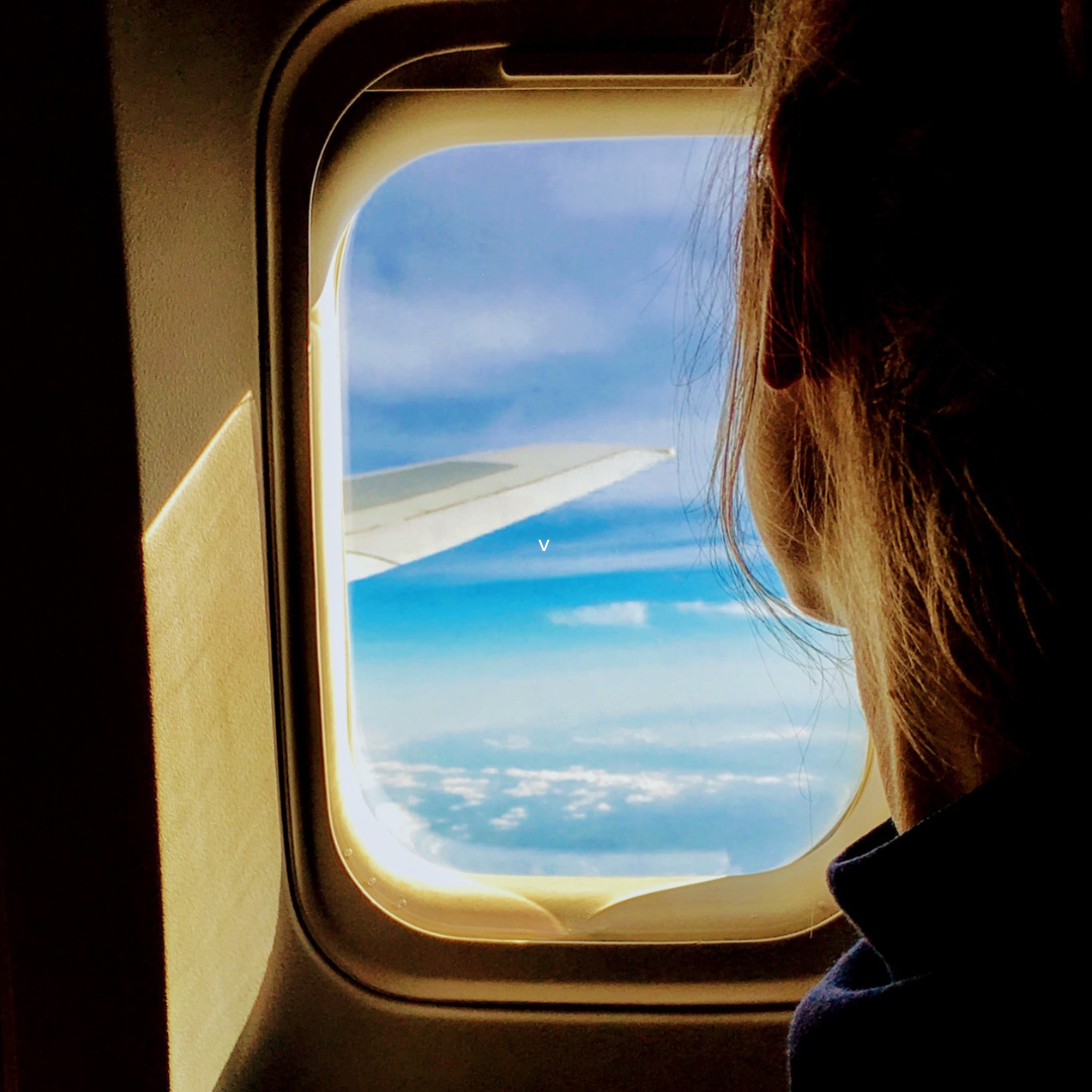 Person Riding on a Plane