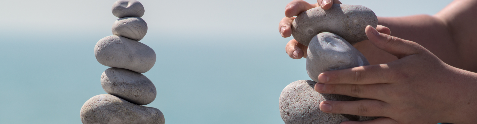 Woman Balancing Stones