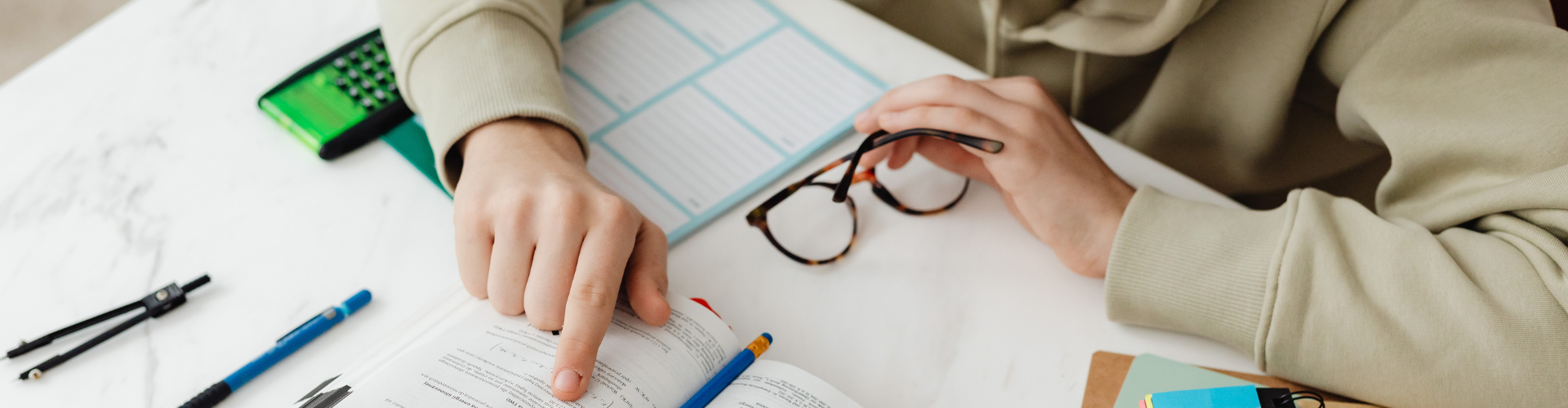 Young Man Reading A Book and Studying