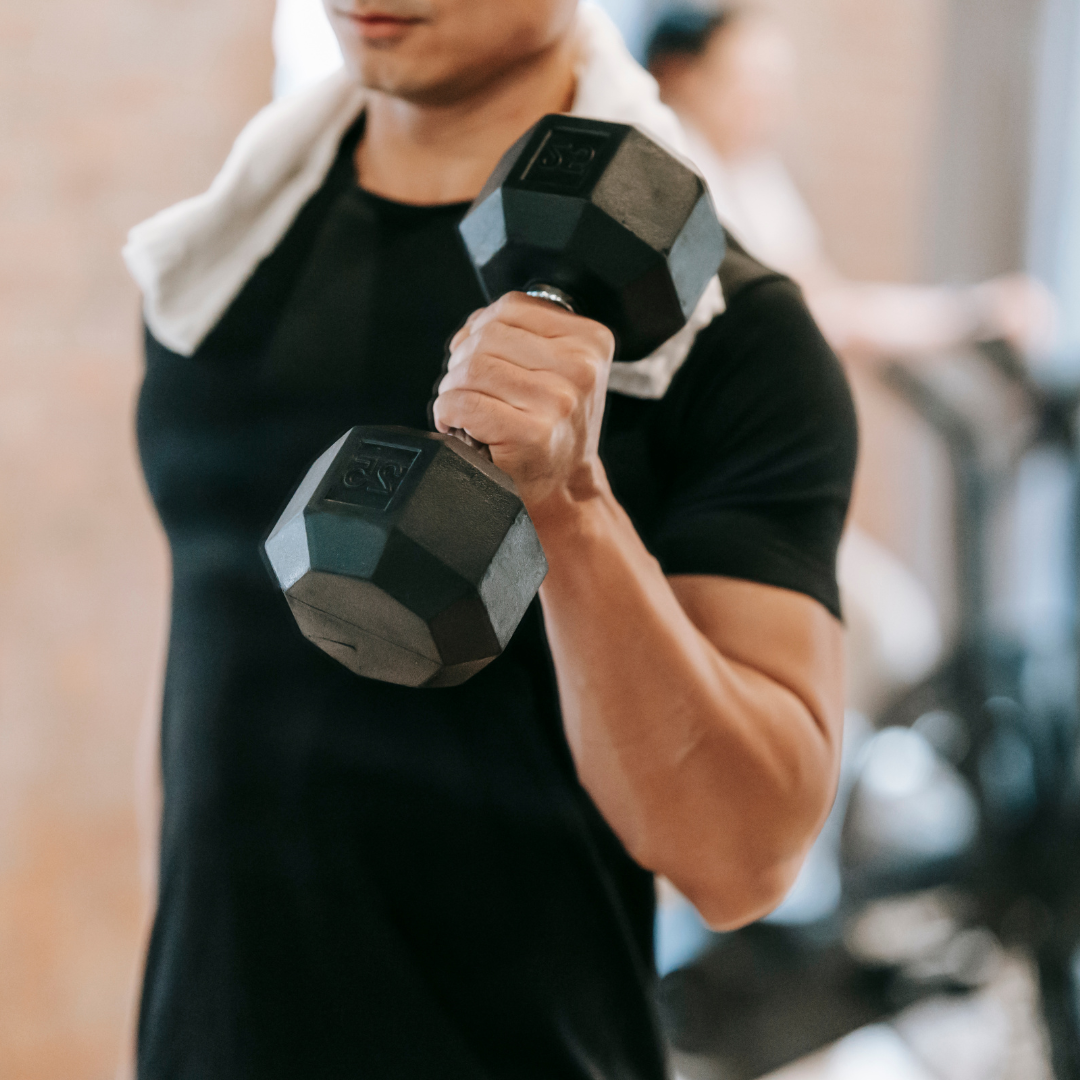 Crop man doing weightlifting workout in gym