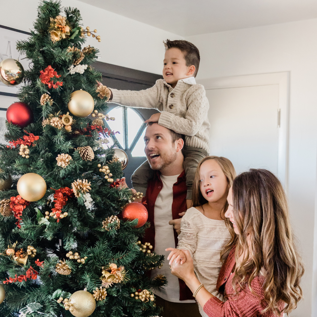 Family Decorating Christmas Tree Together