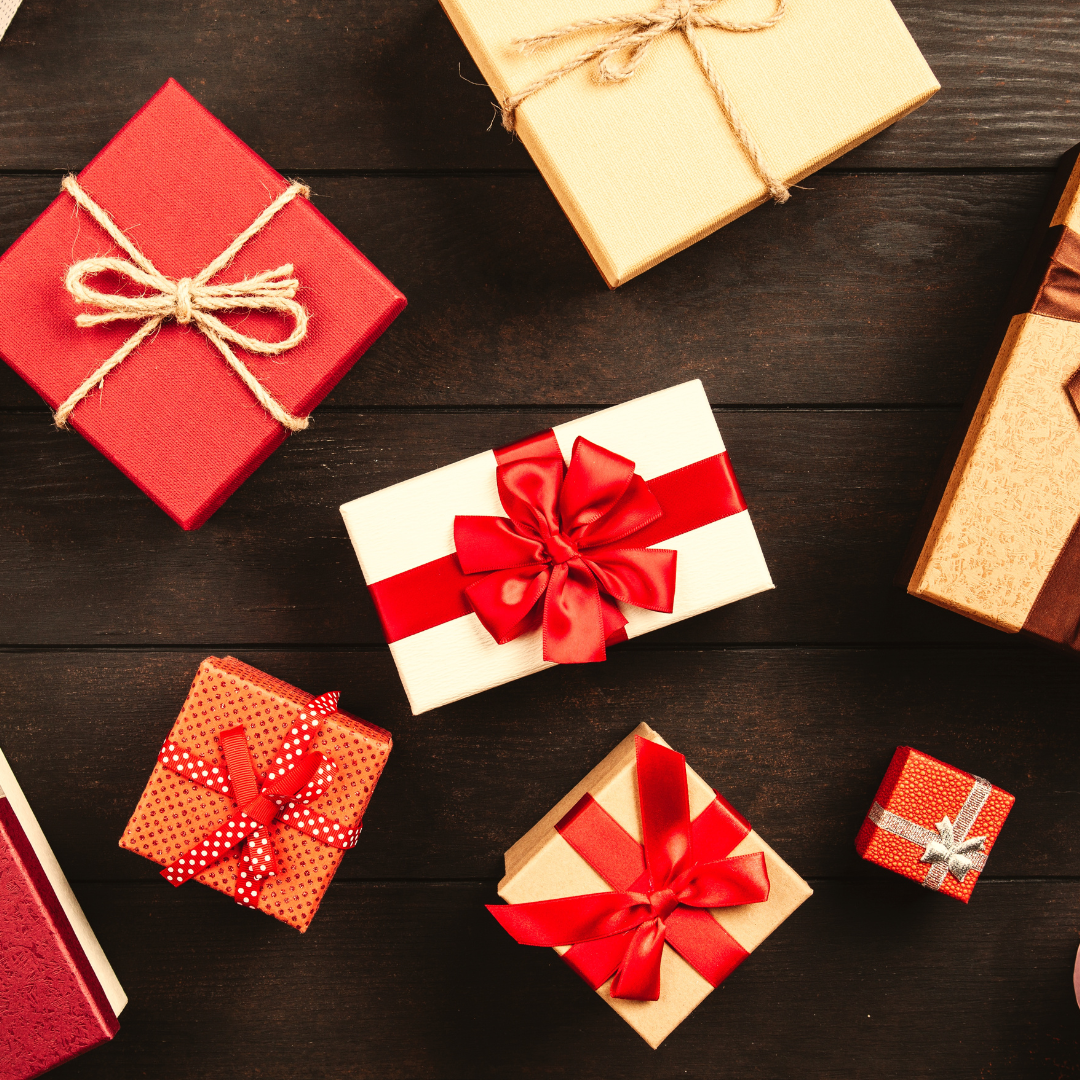 Wrapped Gift Boxes With Ribbons on Table