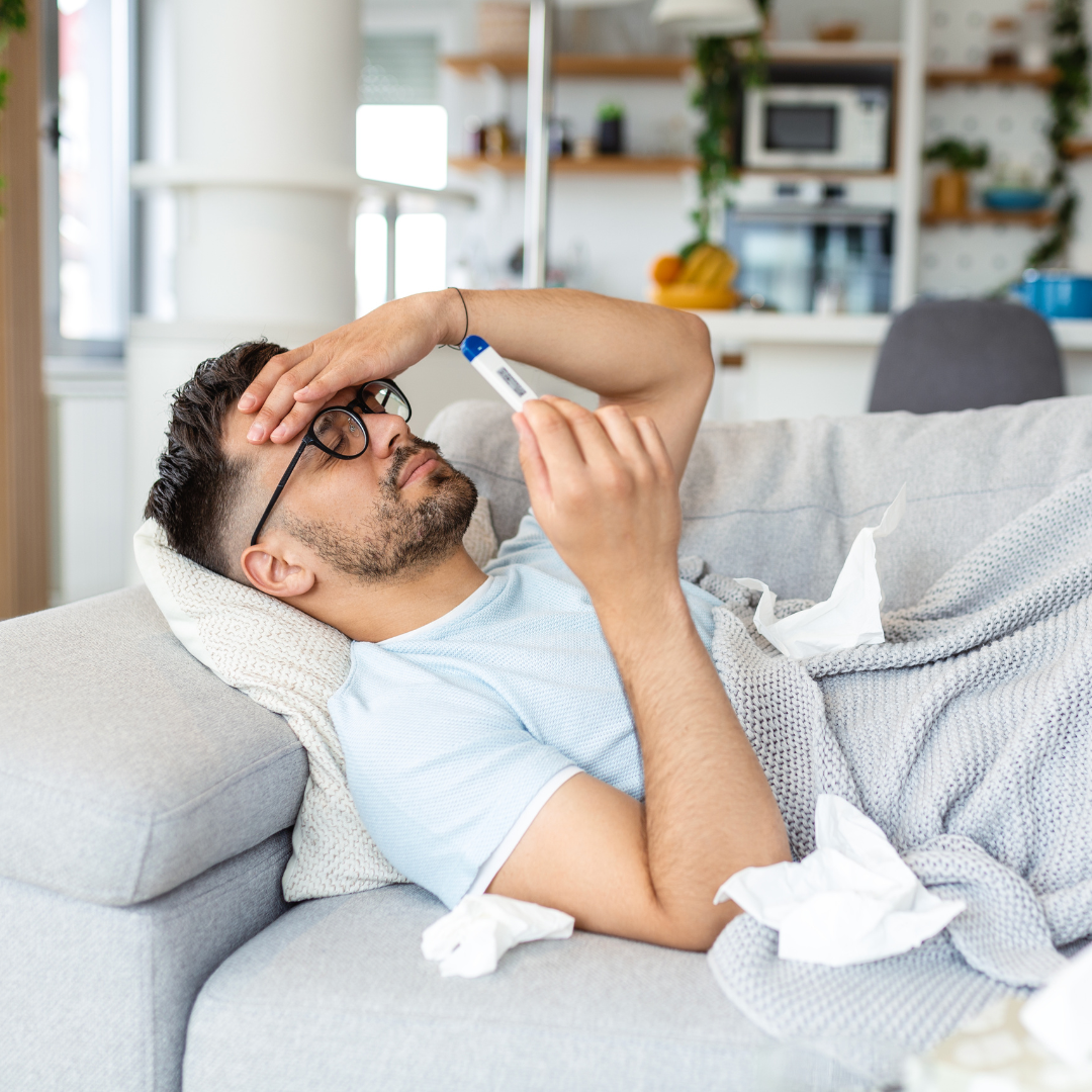 man suffering from covid-19 symptoms lying on bed at home, high fever and coughing prevent him from living a normal life, he has to be on self-isolation. stay home