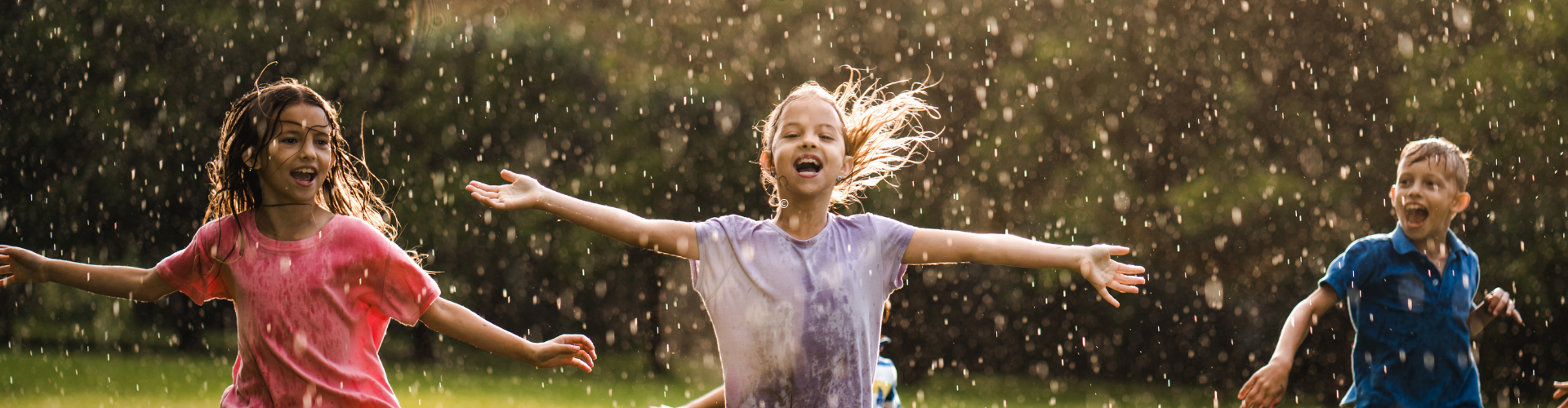 Kids enjoying on the rain