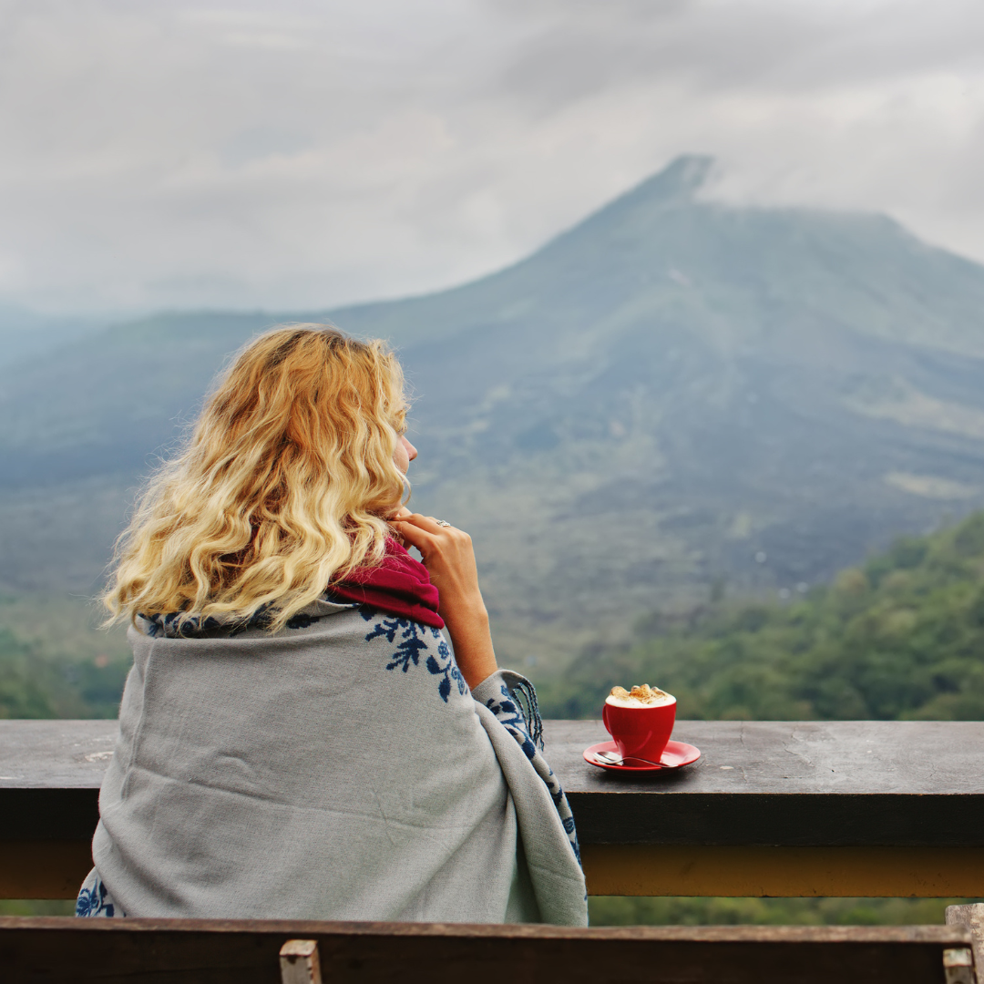 Drinking coffee with mountain view