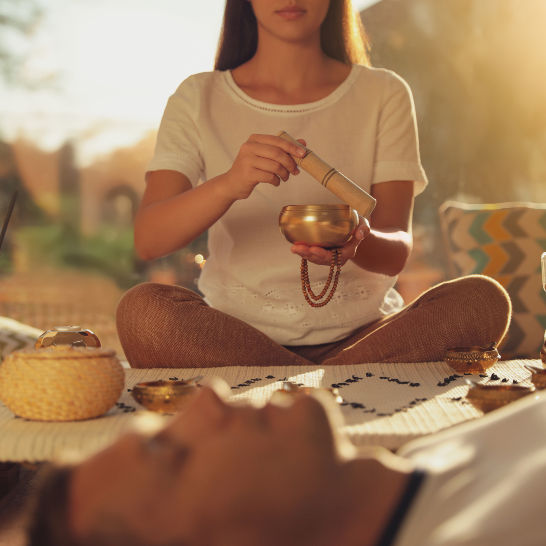 Man at Healing Session with Singing Bowl Indoors