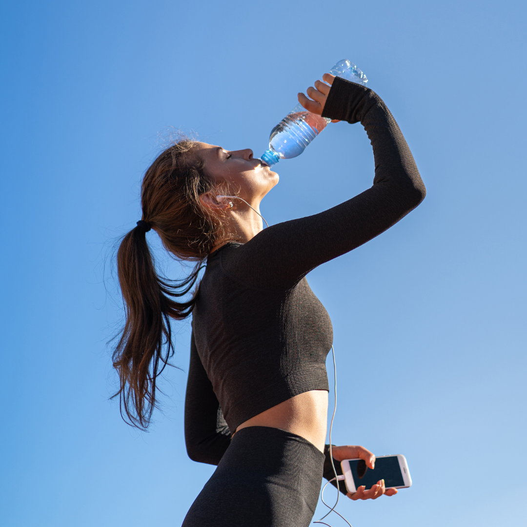 Woman Drinking Water after Workout