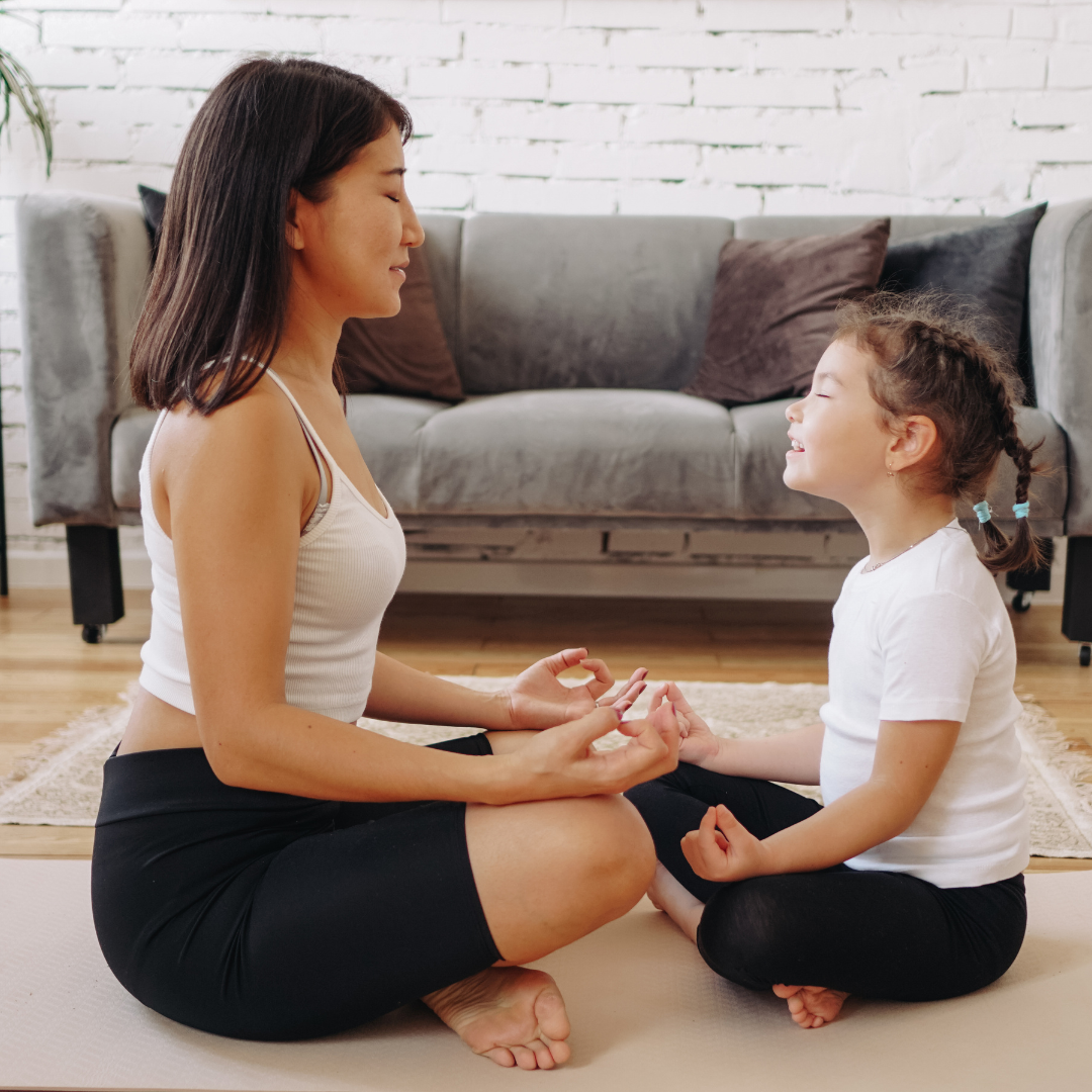 Parent and Child Meditating at Home