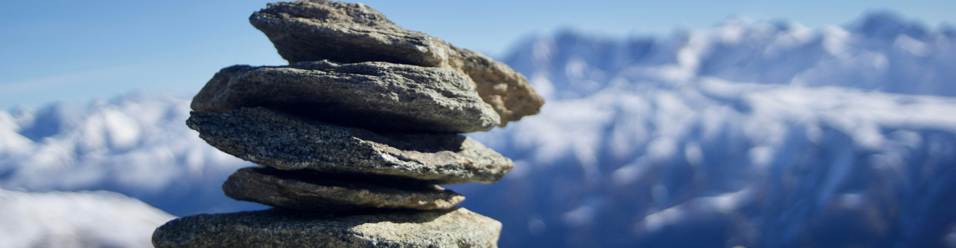 pile of rocks under blue sky at daytime