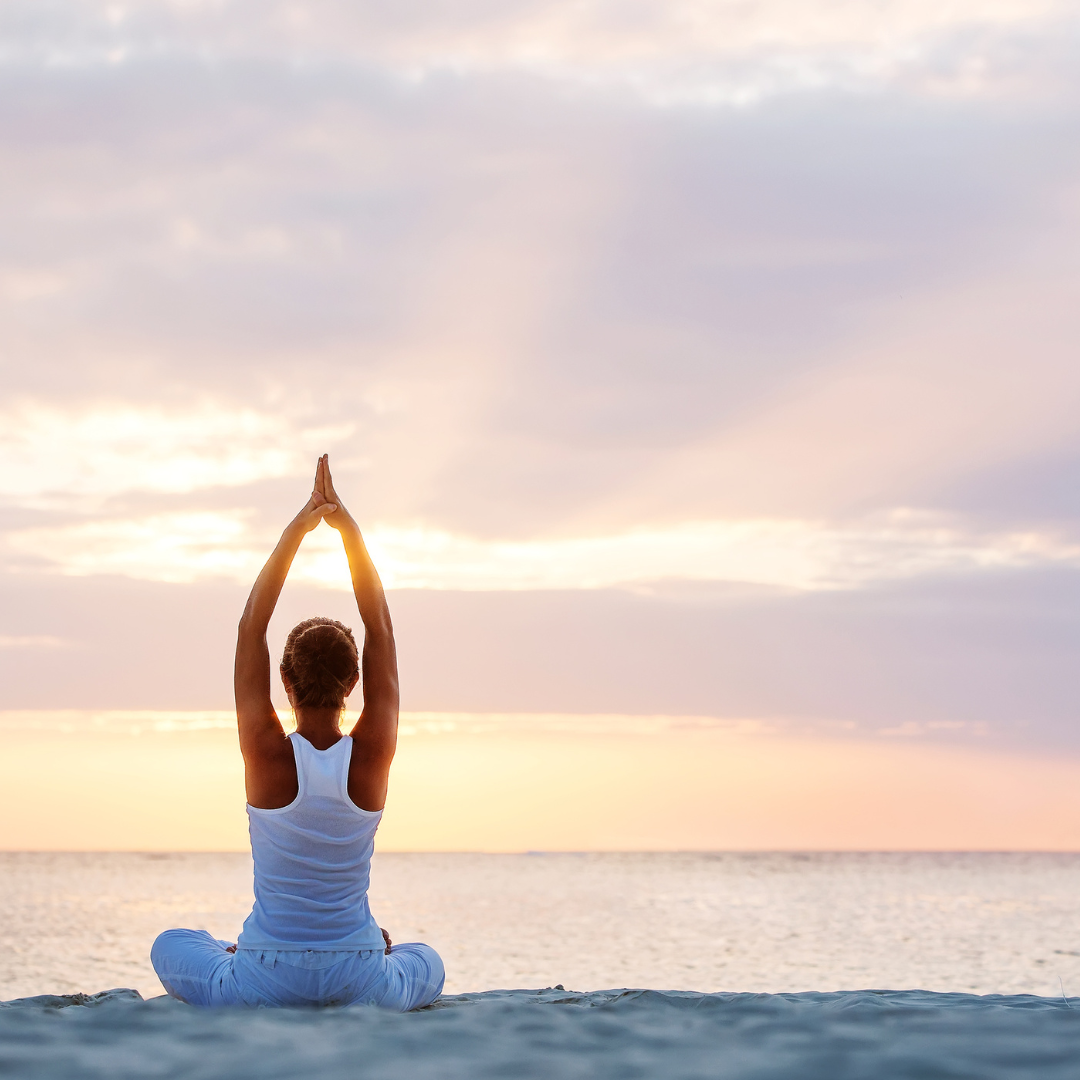 Woman Doing Yoga at Seashore