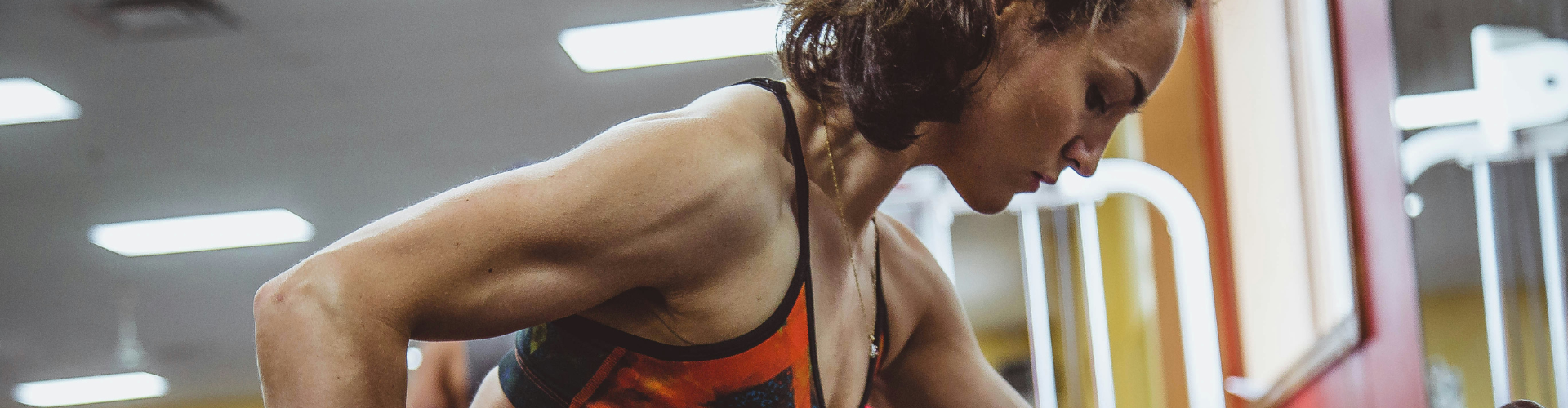 woman seriously performing gym exercise