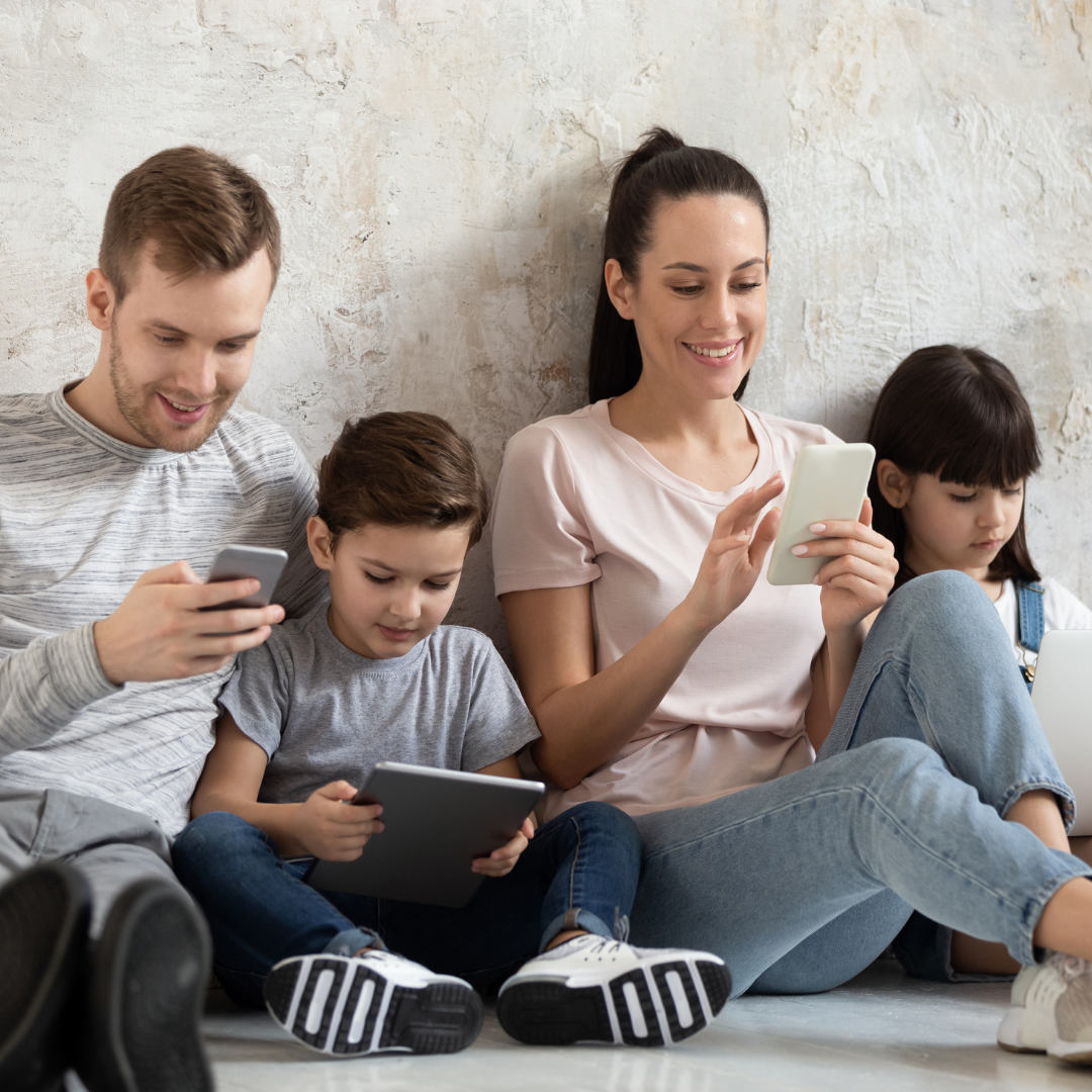 Addicted to technology happy family using different gadgets.