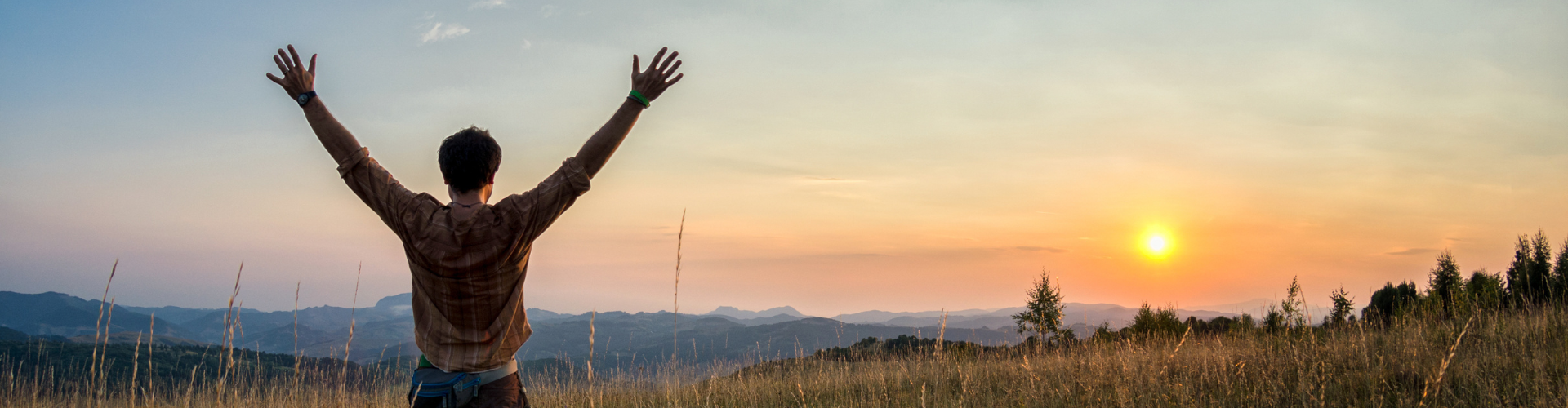 Man raising his arms