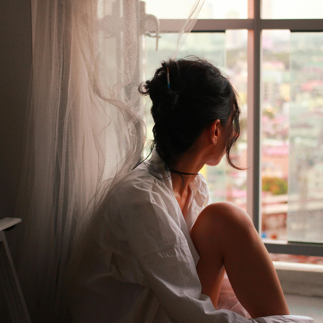 Woman Looking out of Window