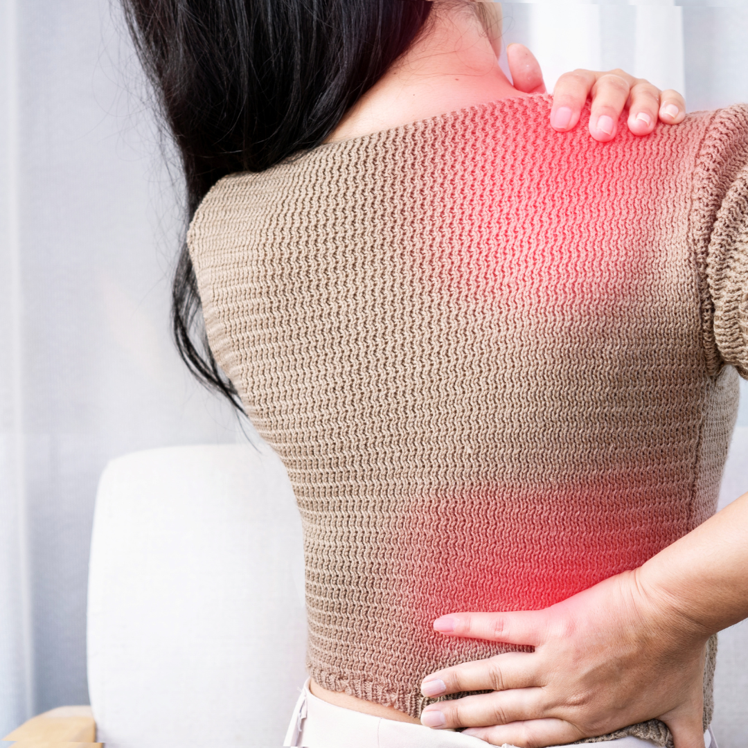woman suffering from shoulder pain or upper back spreading to the lower back