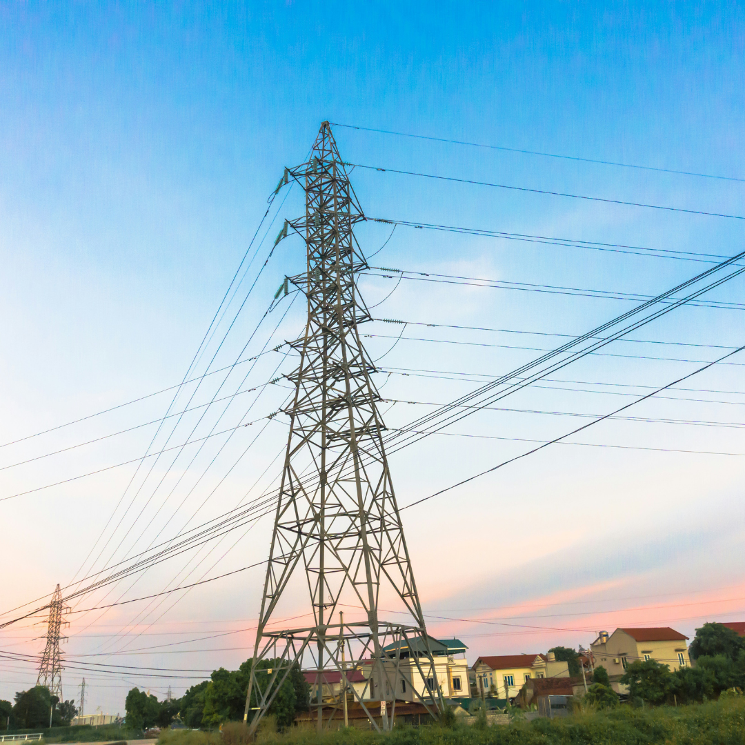 black electric tower under blue sky during daytime