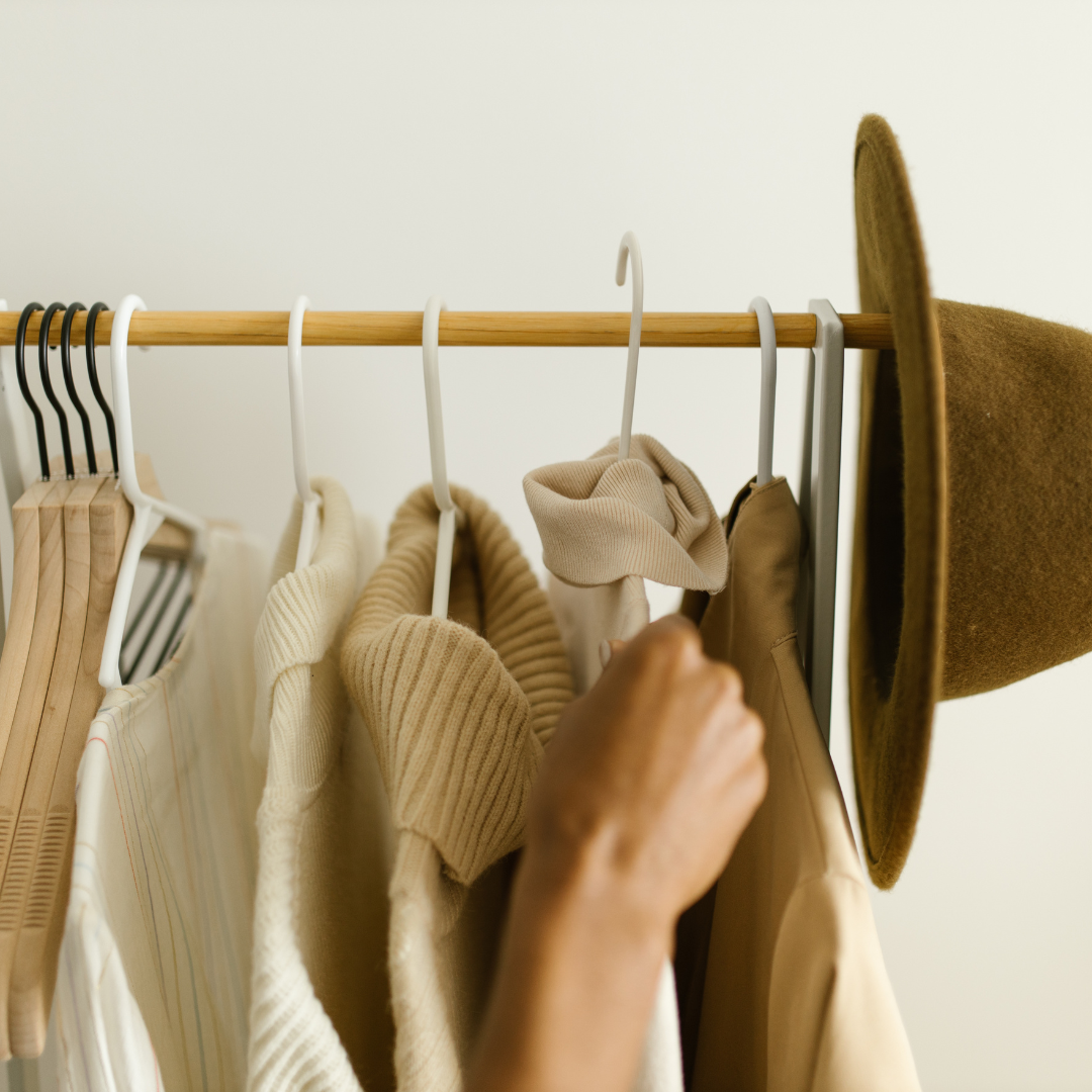 Hanging of Clothes on a Clothing Rack