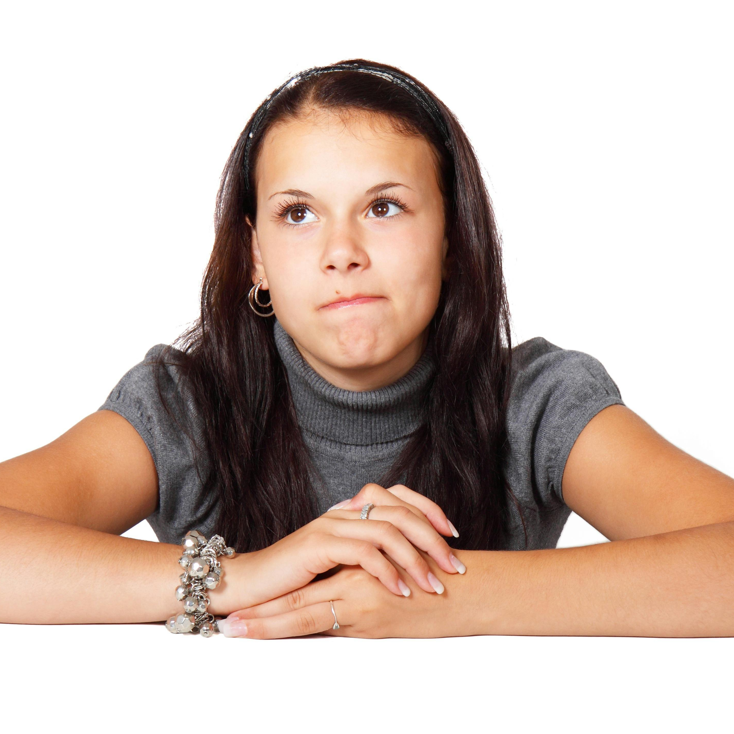 Woman in Gray Blouse Sitting