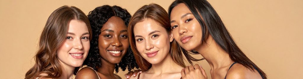 Diverse Group of Young Women Smiling Together